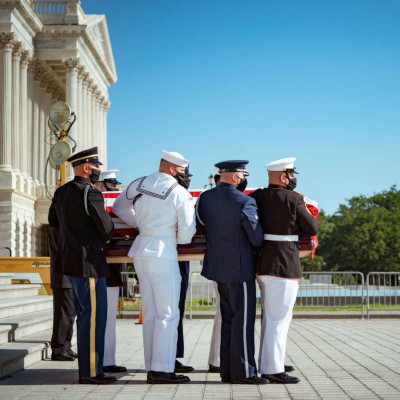 eight soldiers carrying John Lewis casket out the Capitol building