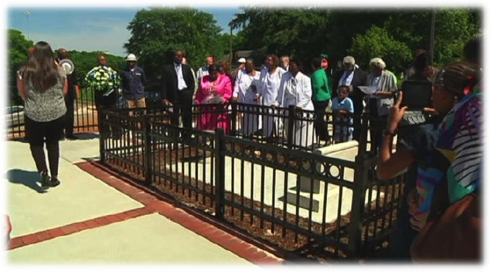 Carrie Tuggle is remembered with a wreath laid at her grave site outside Tuggle Elementary School during ceremony