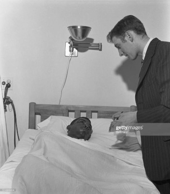 William Barbee speaks to a reporter from his hospital bed after he and other Freedom Riders were attacked at the Montgomery Greyhound Bus Station, May 20, 1961.