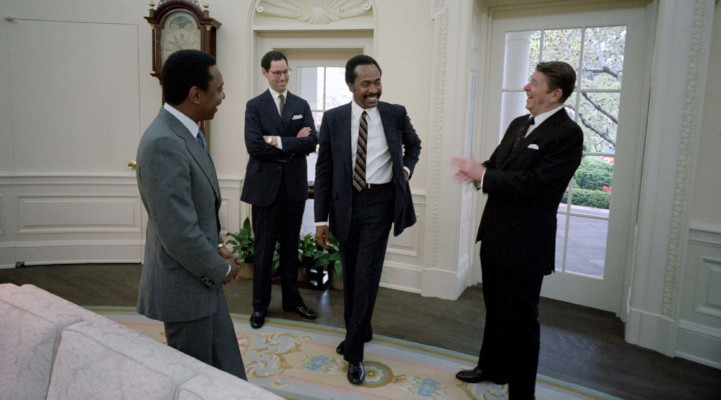 President Ronald Reagan in Oval Office with Melvin Bradley, Dennis Kass and Wendell Gunn, April, 1982.