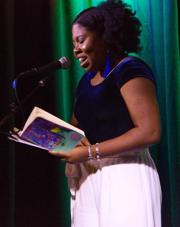 Ashley M. Jones reading onstage from her book Magic City Gospel