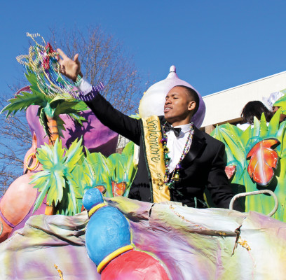 man throwing beads from Mobile Mardi Gras float