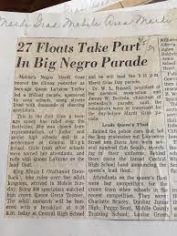 newspaper clipping; article title is "27 Floats Take Part in Big Negro Parade"