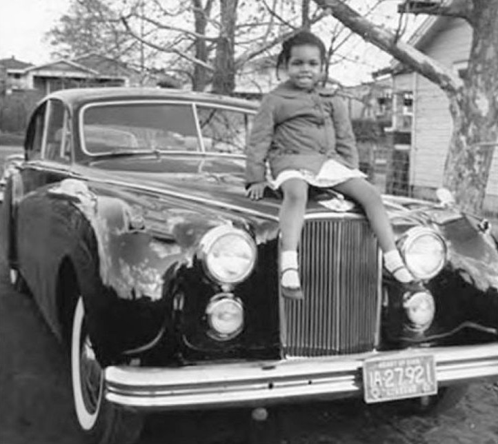 Condoleezza Rice, age five, sits atop her uncle’s car in Birmingham, Alabama