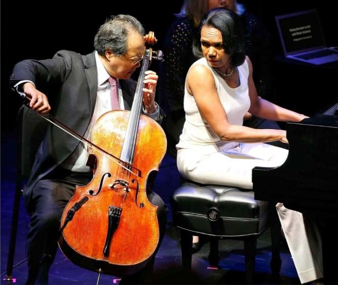 Condoleezza Rice playing the piano, accompanying world-renowned cellist Yo-Yo Ma