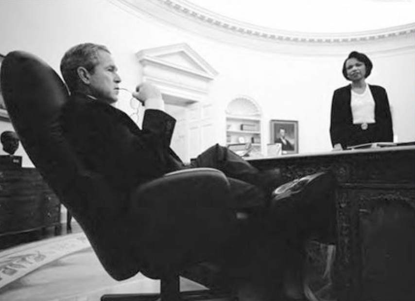 Condoleezza Rice talking with President George W. Bush in his office