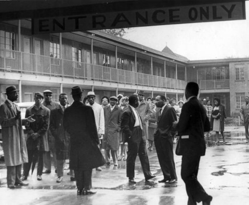 Martin Luther King, Jr. and others gather outside Gaston Motel, 1963.