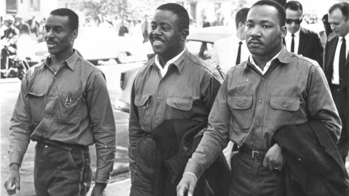 Fred Shuttlesworth, Ralph Abernathy and Martin Luther King Jr. walking together at the Good Friday March in Birmingham, Alabama on April 12, 1963