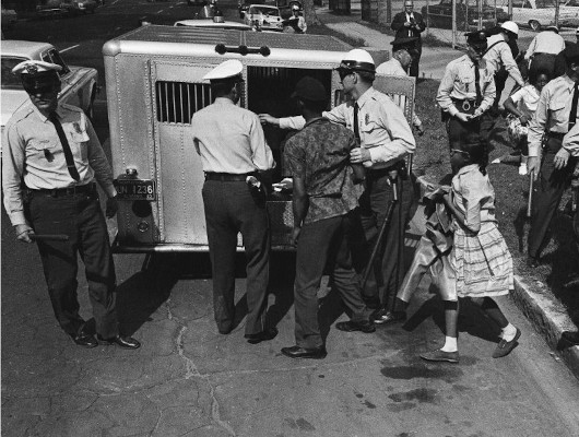 Students being loaded into police wagons