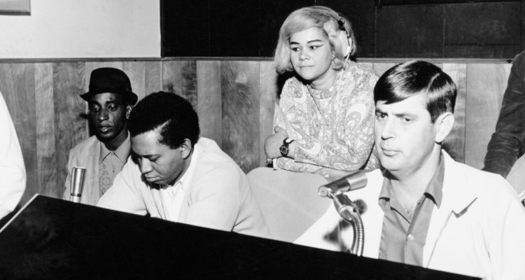 Rick Hall in the studio with singer Etta James and members of the house band, circa late 1960s.