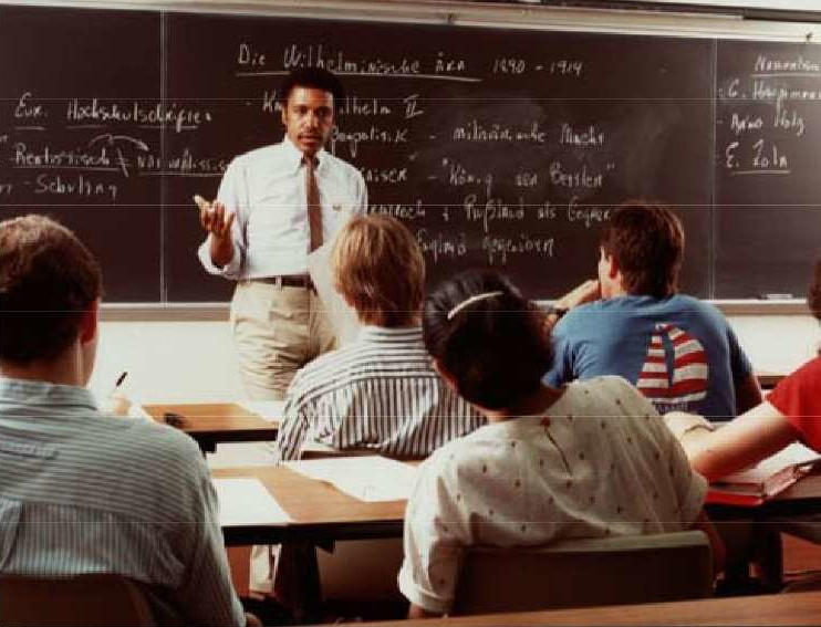 James McLeod teaching in a classroom of students