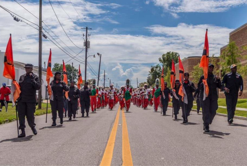 Band and color guard at Mobile Area Mardi Gras parade