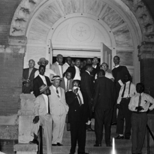 Group of men standing at the entrance of First Baptist Church in Montgomery, Alabama